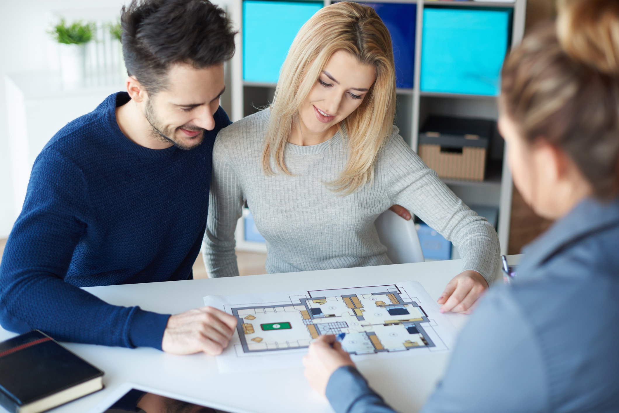 Residential renovation planning: Couple discussing home extension designs with Smartway Builders.